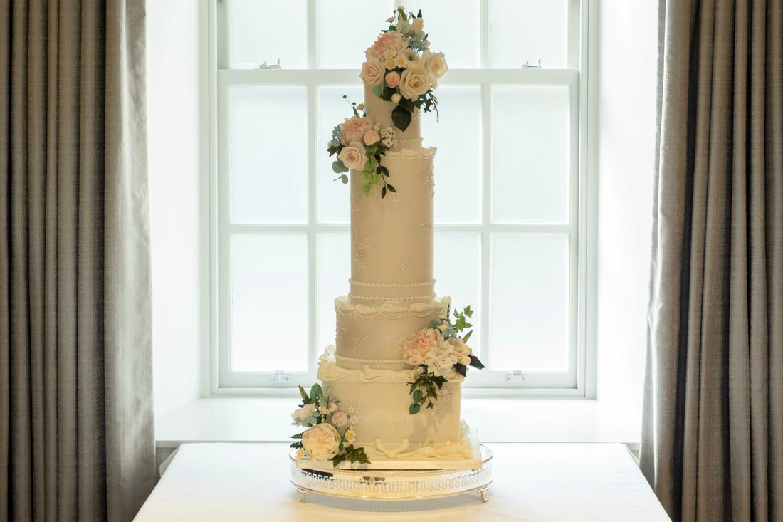 Tall, elegant wedding cake at The Samling Hotel, Windermere, The Lake District