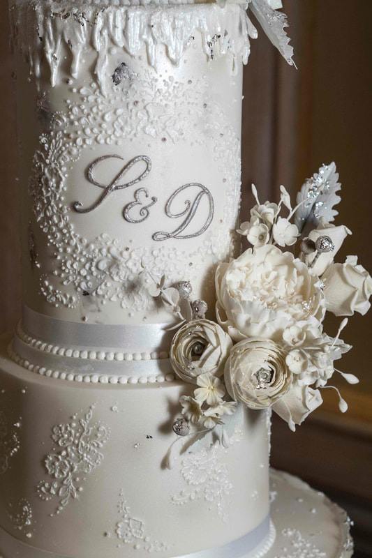 Detail from dramatic white and silver winter wedding cake at Abbey House Hotel, The Lake District