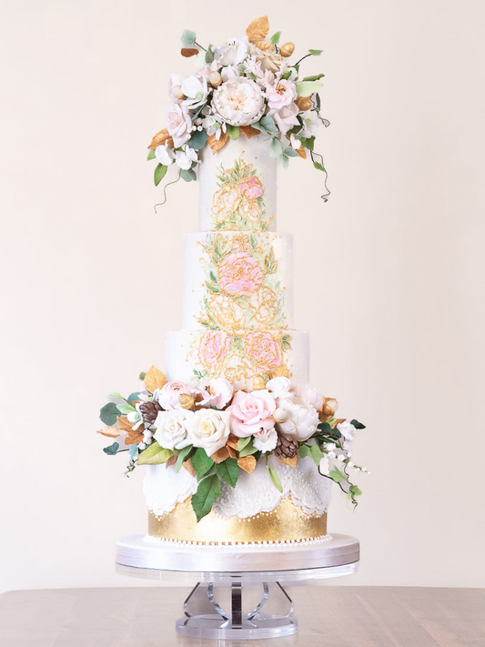 4 tier striking gold and white wedding cake with colourful flower detailing, gold leaf, and sugar flowers 41