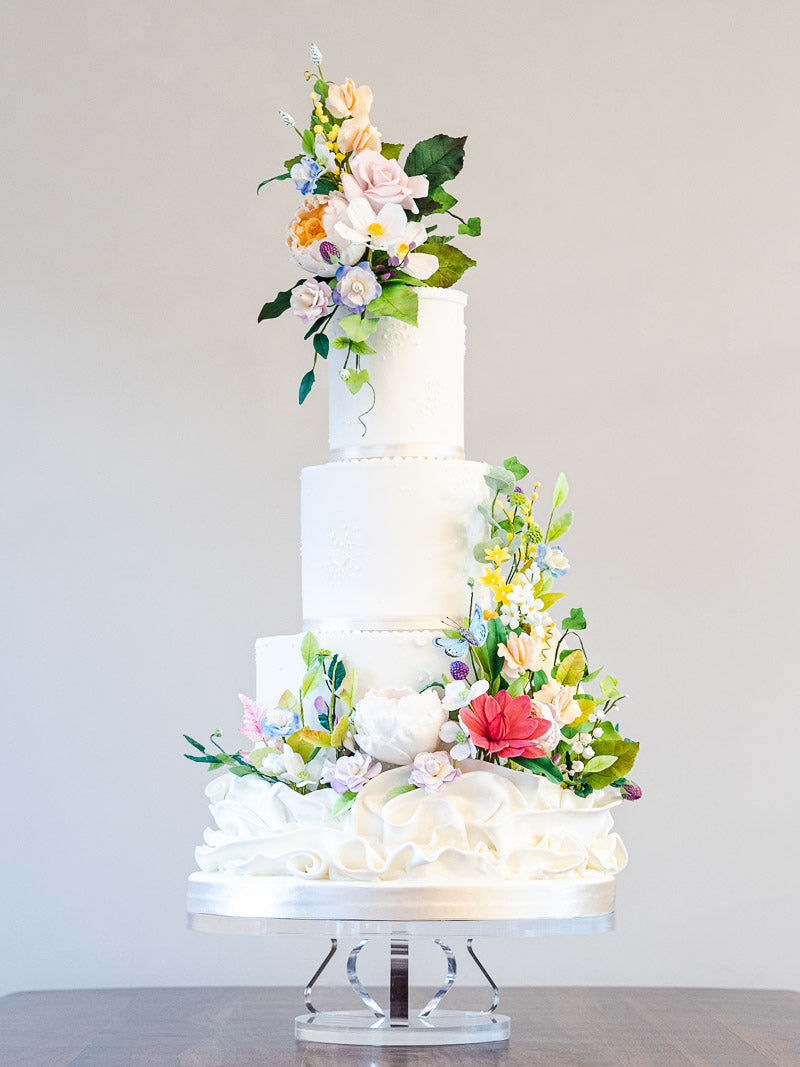 Four tier wedding cake with sugar blooms