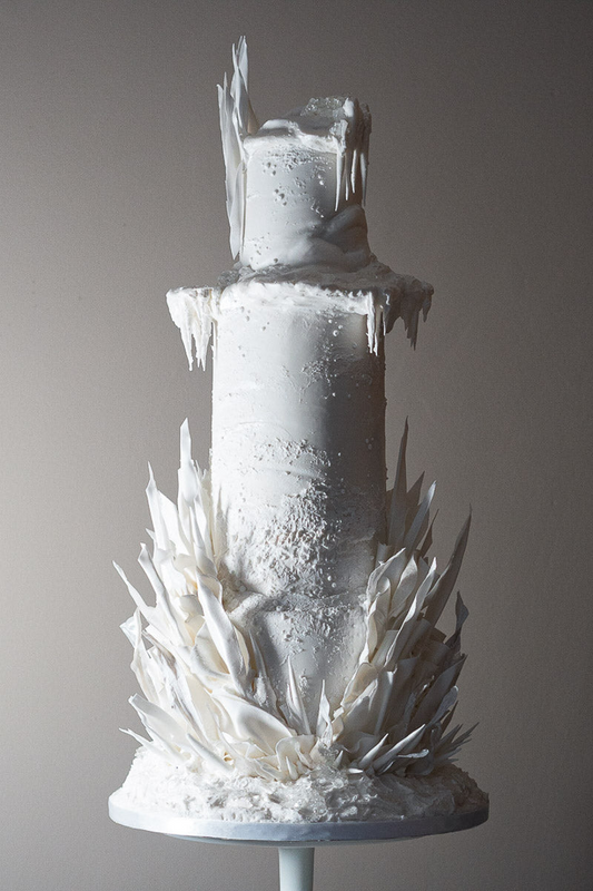 4 tier dramatic white shard wedding cake with white ice detailing 17