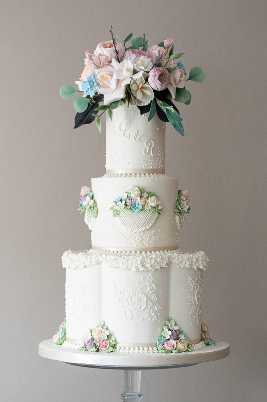 3 tier white majestic textured wedding cake with sugar flowers and hand piped flower details 26