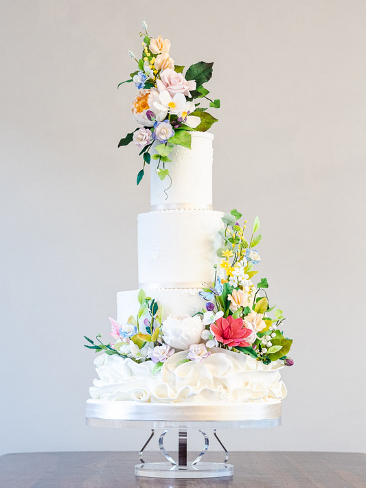 3 tier stylish white wedding cake with colourful sugar flowers and white sugar frill 8