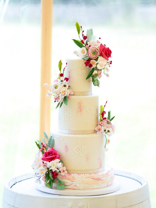 3 tier pretty white and pink wedding cake with white flower details and pink and white sugar flowers 35