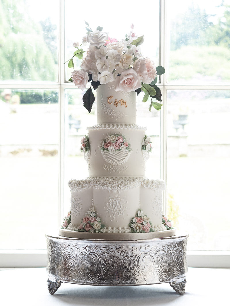 Wedding Cake Manchester | 3 tiers with a petal base, hand piped royal iced detail and sugar flowers