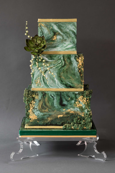 3 tier square wedding cake design with an ebru art effect and sugar succulent for a wedding at Mitton Hall, Lancashire